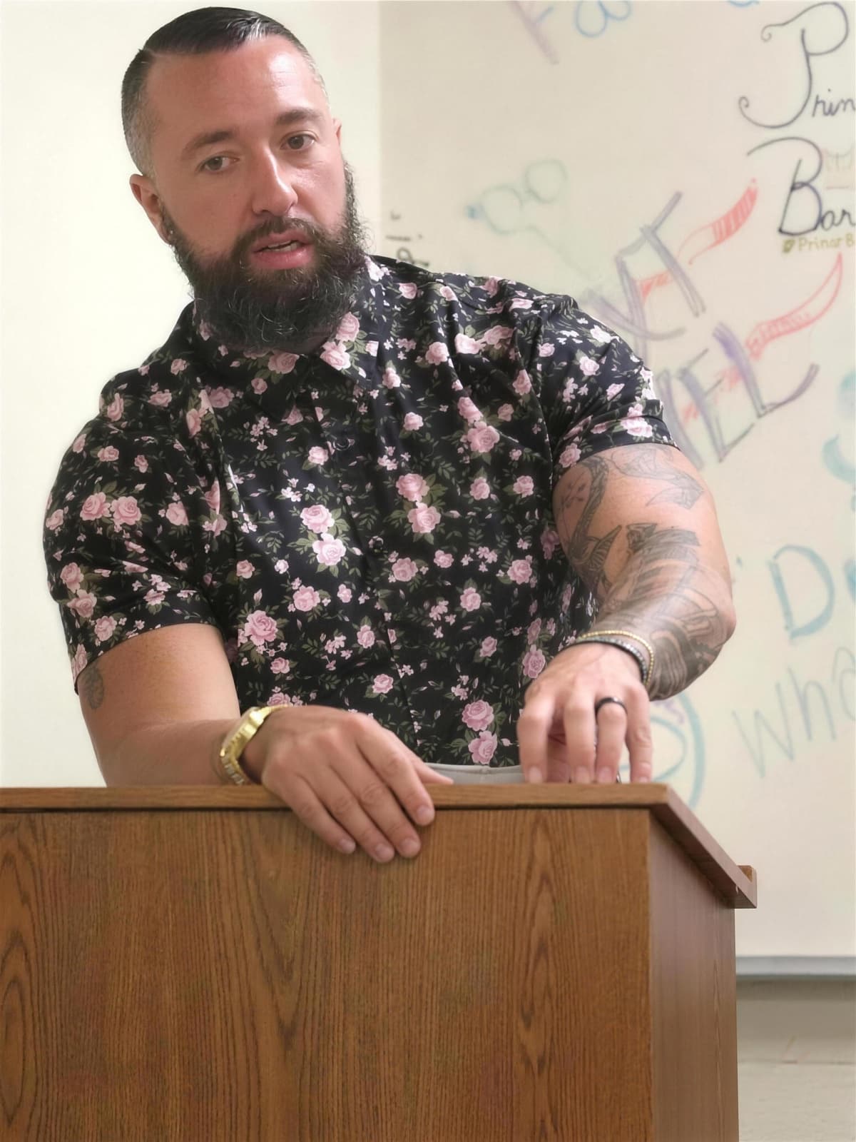 Justin Marlow teaching from the front of the classroom.